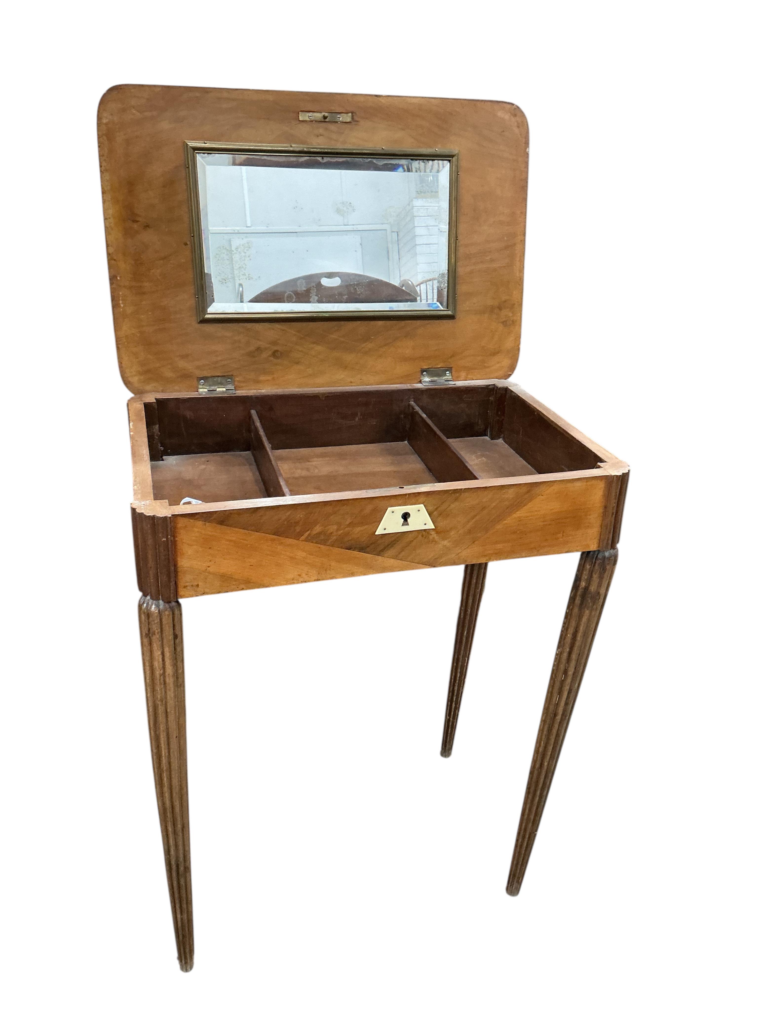 An early 20th century Continental mahogany enclosed dressing table in need of restoration, width 60cm, depth 40cm, height 74cm